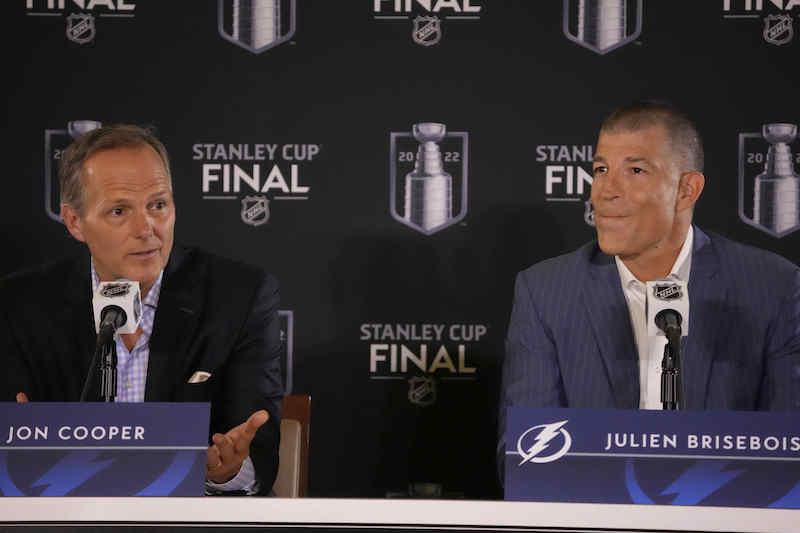 Tampa Bay Lightning head coach Jon Cooper and general manager Julien Brisebois speaks during media day for the 2022 Stanley Cup Final at Ball Arena.