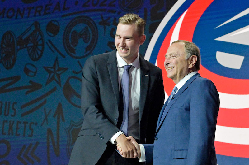 David Jiricek shakes hands with NHL commissioner Gary Bettman after being selected as the number six overall pick to the Columbus Blue Jackets in the first round of the 2022 NHL Draft at Bell Centre. 