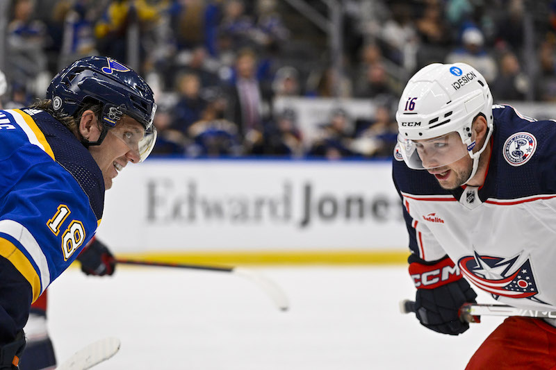 St. Louis Blues' Robert Thomas talks with Columbus Blue Jackets' Brendan Gaunce before a face off during the first period at Enterprise Center.