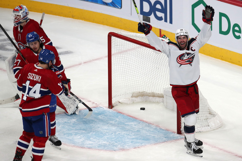Columbus Blue Jackets' Boone Jenner celebrates a Patrik Laine goal against Montreal Canadiens goaltender Sam Montembeault during the third period at Bell Centre.
