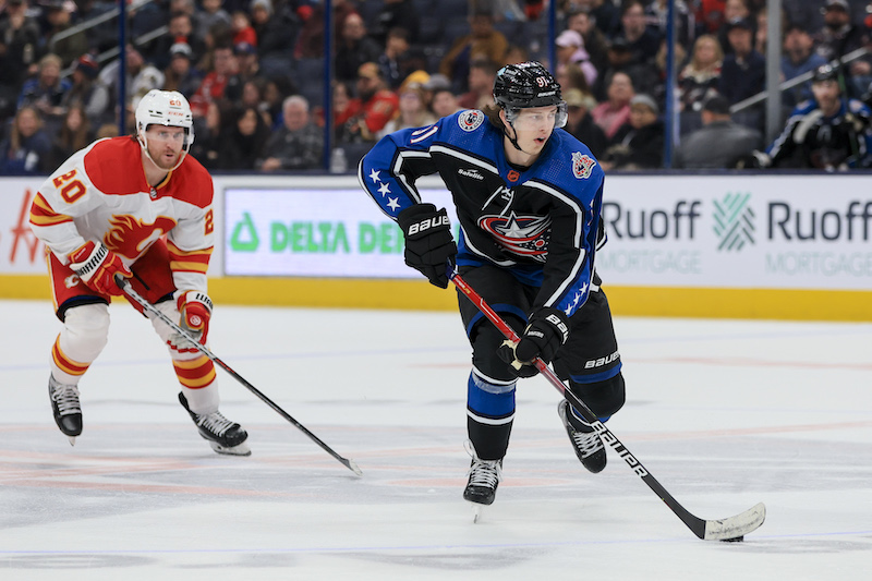 Columbus Blue Jackets' Kent Johnson skates with the puck against the Calgary Flames in the third period at Nationwide Arena.