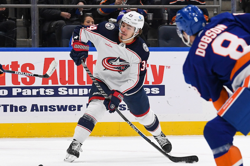 Columbus Blue Jackets' Cole Sillinger attempts a shot against the New York Islanders during the first period at UBS Arena. Columbus Blue Jackets' Cole Sillinger attempts a shot against the New York Islanders during the first period at UBS Arena.
