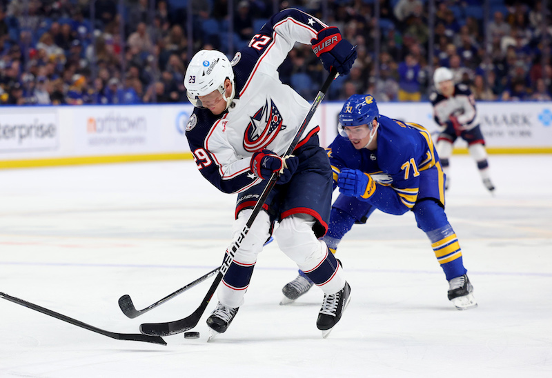 Columbus Blue Jackets' Patrik Laine looks to control the puck as Buffalo Sabres' Victor Olofsson defends during the third period at KeyBank Center. Columbus Blue Jackets' Patrik Laine looks to control the puck as Buffalo Sabres' Victor Olofsson defends during the third period at KeyBank Center.