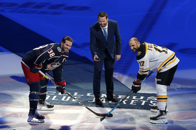 Former Columbus Blue Jackets' Rick Nash drops the ceremonial puck with Columbus Blue Jackets' Boone Jenner and Boston Bruins' Nick Foligno before the start of the first period at Nationwide Arena.