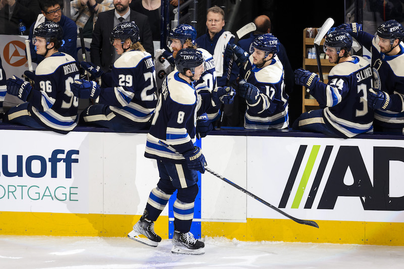 Columbus Blue Jackets' Zach Werenski celebrates with teammates on the bench after scoring a goal against the Buffalo Sabres in the second period at Nationwide Arena.