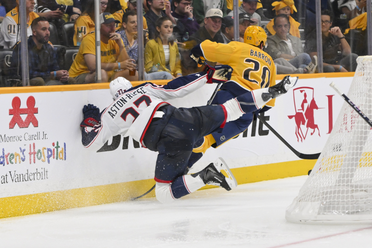 Oct 9, 2025; Nashville, Tennessee, USA; Nashville Predators defenseman Justin Barron (20) checks Columbus Blue Jackets center Zachary Aston-Reese (27) during the third period at Bridgestone Arena. Oct 9, 2025; Nashville, Tennessee, USA; Nashville Predators defenseman Justin Barron (20) checks Columbus Blue Jackets center Zachary Aston-Reese (27) during the third period at Bridgestone Arena.