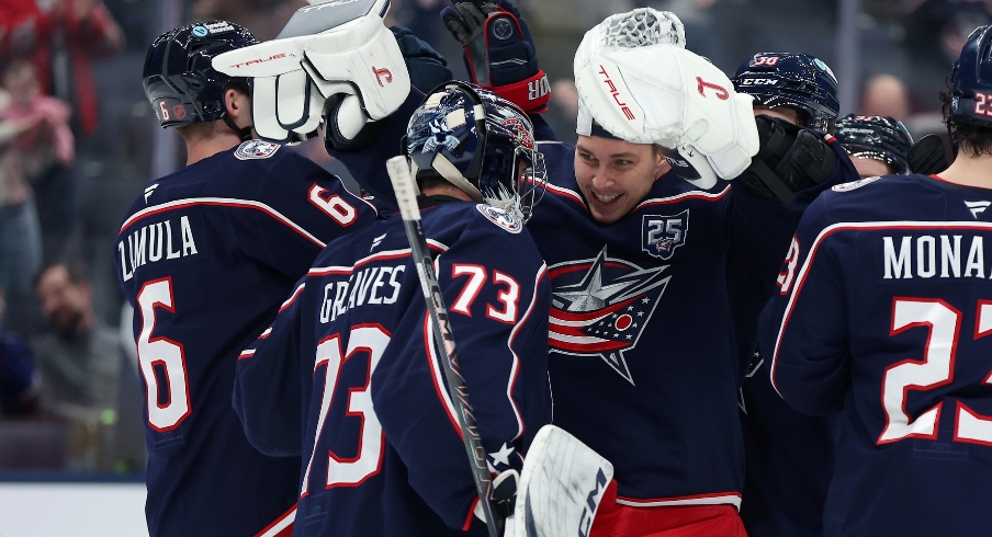 Jan 24, 2026; Columbus, Ohio, USA; Columbus Blue Jackets goaltender Elvis Merzlikins (facing) celebrates with Columbus Blue Jackets goaltender Jet Greaves (73) following the game against the Tampa Bay Lightning at Nationwide Arena. Jan 24, 2026; Columbus, Ohio, USA; Columbus Blue Jackets goaltender Elvis Merzlikins (facing) celebrates with Columbus Blue Jackets goaltender Jet Greaves (73) following the game against the Tampa Bay Lightning at Nationwide Arena.