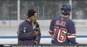 Chance the Rapper examines Brady Skjei's nameplate on Saturday Night Live