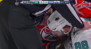 Patrick Maroon feels up Brent Burns beard after play is stopped