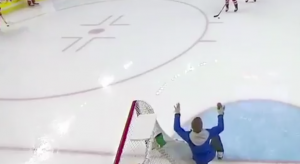 An ice worker tried to avoid pucks while hockey players from Czech Republic-Sweden warmup