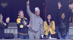 Ryan Shazier stands up at a Pittsburgh Penguins game for one of his first public appearances since his spinal injury