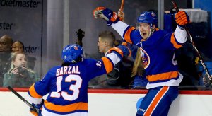 Mat Barzal celebrates a goal with his teammates