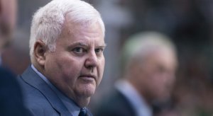 Ken Hitchcock looks on from the bench over his players for the Dallas Stars.