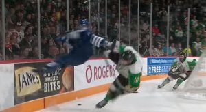  Max Martin sends Keith Getson flying into the boards with a wild hit to kick off Memorial Cup action.