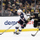 Zach Werenski skates past Boston Bruins defenseman Kevin Shattenkirk