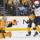 Oct 9, 2025; Nashville, Tennessee, USA; Nashville Predators goaltender Juuse Saros (74) makes a glove save from the shot of Columbus Blue Jackets center Sean Monahan (23) during the first period at Bridgestone Arena.