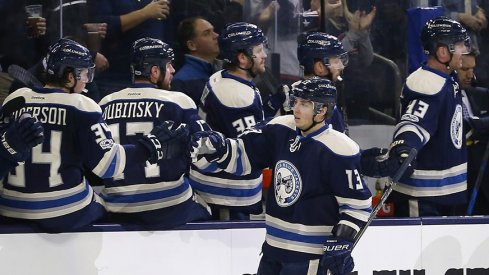 Cam Atkinson celebrates with his Blue Jackets teammates after scoring to put Columbus up 2-0 on Buffalo