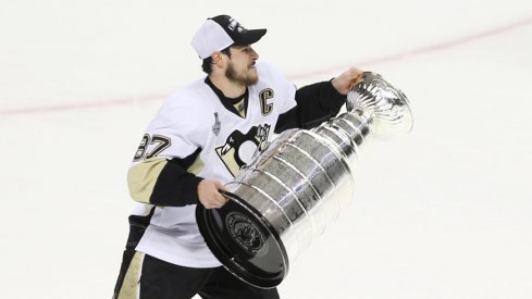 Pittsburgh Penguins captain Sidney Crosby skates with the Stanley Cup in 2016. 