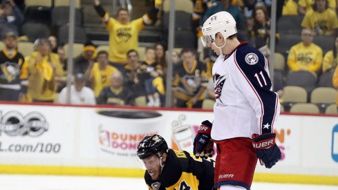 Columbus Blue Jackets left wing Matt Calvert (11) reacts after cross checking Pittsburgh Penguins right wing Tom Kuhnhackl.