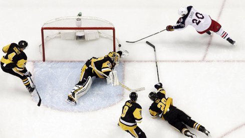 Brandon Saad of the Columbus Blue Jackets shoots wide of Pittsburgh Penguins goalie Marc-Andre Fleury.