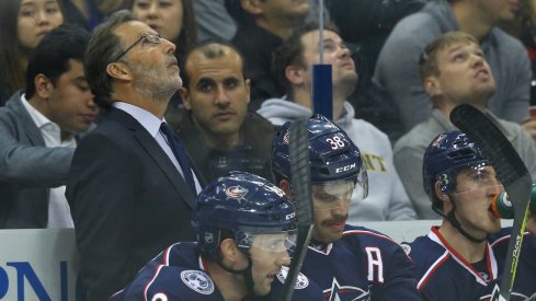 John Tortorella looks up at the scoreboard during a home game.