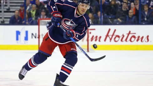 Jack Johnson passing the puck to his teammates up ice