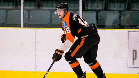 Kale Howarth skating with the puck in a BCHL game.