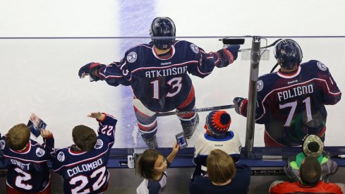 Nick Foligno and Cam Atkinson get ready during warm up