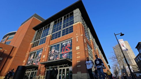 Columbus Blue Jackets' fans get ready to enter Nationwide Arena for a game.