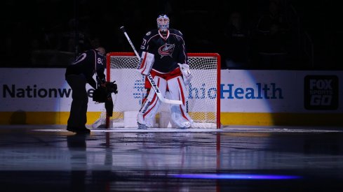 Joonas Korpisalo gets ready for the game to start during the national anthem