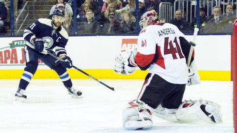 Nick Foligno takes a shot on Senators goalie Craig Anderson