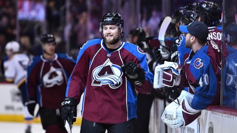 John Mitchell celebrates a goal with his teammates