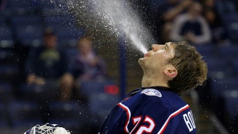 Sergei Bobrovsky takes a moment in between play to stay hydrated