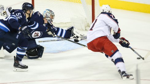 Nick Foligno moves in on Steve Mason before scoring a goal.