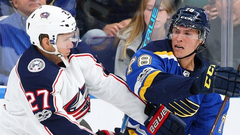 Ryan Murray battles a St. Louis Blues player in the Blue Jackets 4-1 loss. 