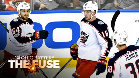 Tyler Motte celebrates a goal with Pierre-Luc Dubois and Boone Jenner