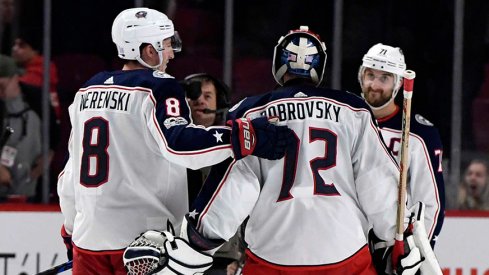 Nick Foligno goes in for the hug after a Blue Jackets win.