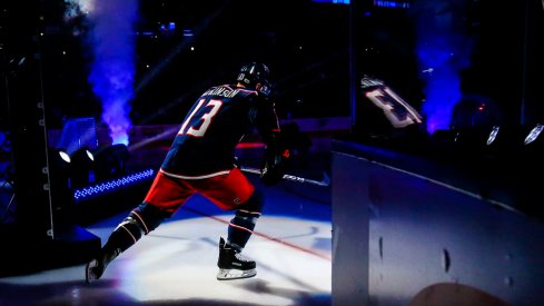 Cam Atkinson skates onto the ice during the Blue Jackets season opener 