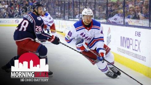 Michael Grabner tries to skate around Oliver Bjorkstrand at Nationwide Arena