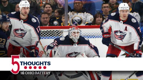 Brandon Dubinsky and Jack Johnson protect the net front for the Blue Jackets