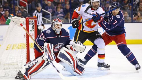 Sergei Bobrovsky awaits the puck as Jaromir Jagr sits near the front of the net