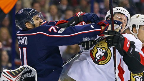 Nick Foligno and Dion Phaneuf shove each other during a stoppage in play during the Ottawa-Columbus game.