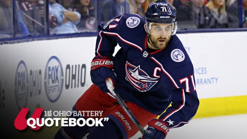 Nick Foligno eyes the puck while skating against the Ottawa Senators 