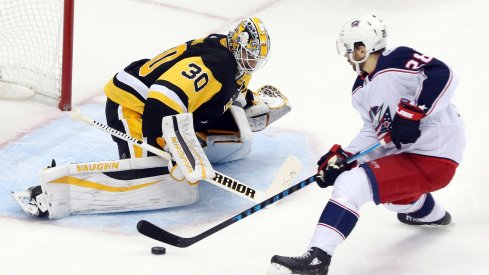 Oliver Bjorkstrand tries to slip the puck by Matt Murray during the shootout