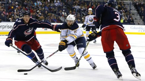 Blue Jackets defensemen Zach Werenski and Seth Jones 