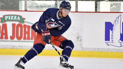 Robbie Stucker skates with the puck at Blue Jackets development camp