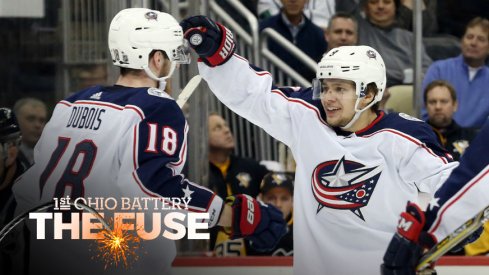 Artemi Panarin and Pierre-Luc Dubois celebrate a goal against the Penguins.