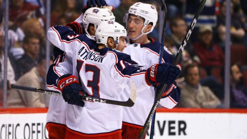 Cam Atkinson celebrates with teammates