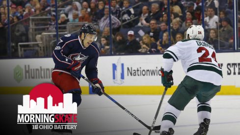 Jack Johnson tries to skate past Matt Dumba