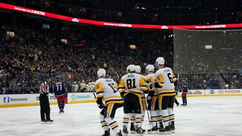 The Pittsburgh Penguins celebrate scoring a goal during the first period of their game against the Blue Jackets